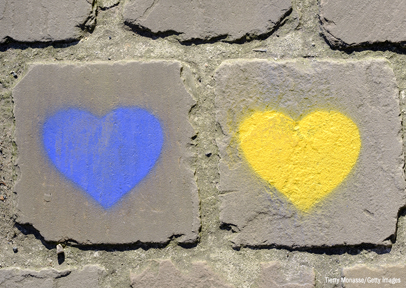 Photo of blue and yellow hearts painted on the street near the Ukraine's mission to the EU in Brussels, 8 March 2022.