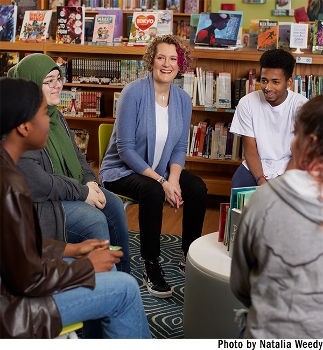 Julie Stivers and students in the school library.