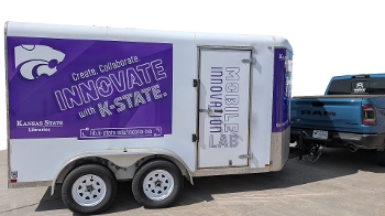 trailer branded with K-State logo hooked up to truck